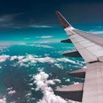 Airplane Wing Above Clouds